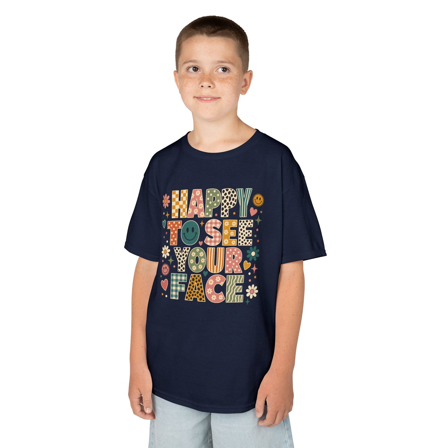 Boy wearing a navy TEEZOCA Happy to See Your Face boho kids t-shirt, a cute back to school shirt for the first day.
