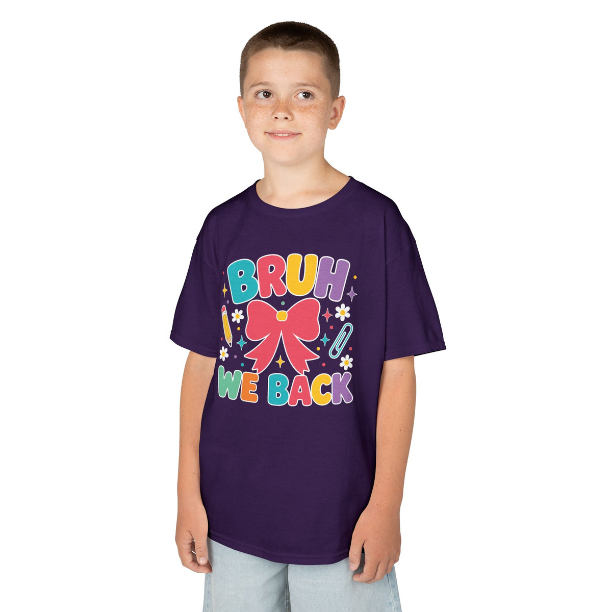 Boy wearing a purple TEEZOCA Bruh We Back kids t-shirt, a funny back to school shirt.
