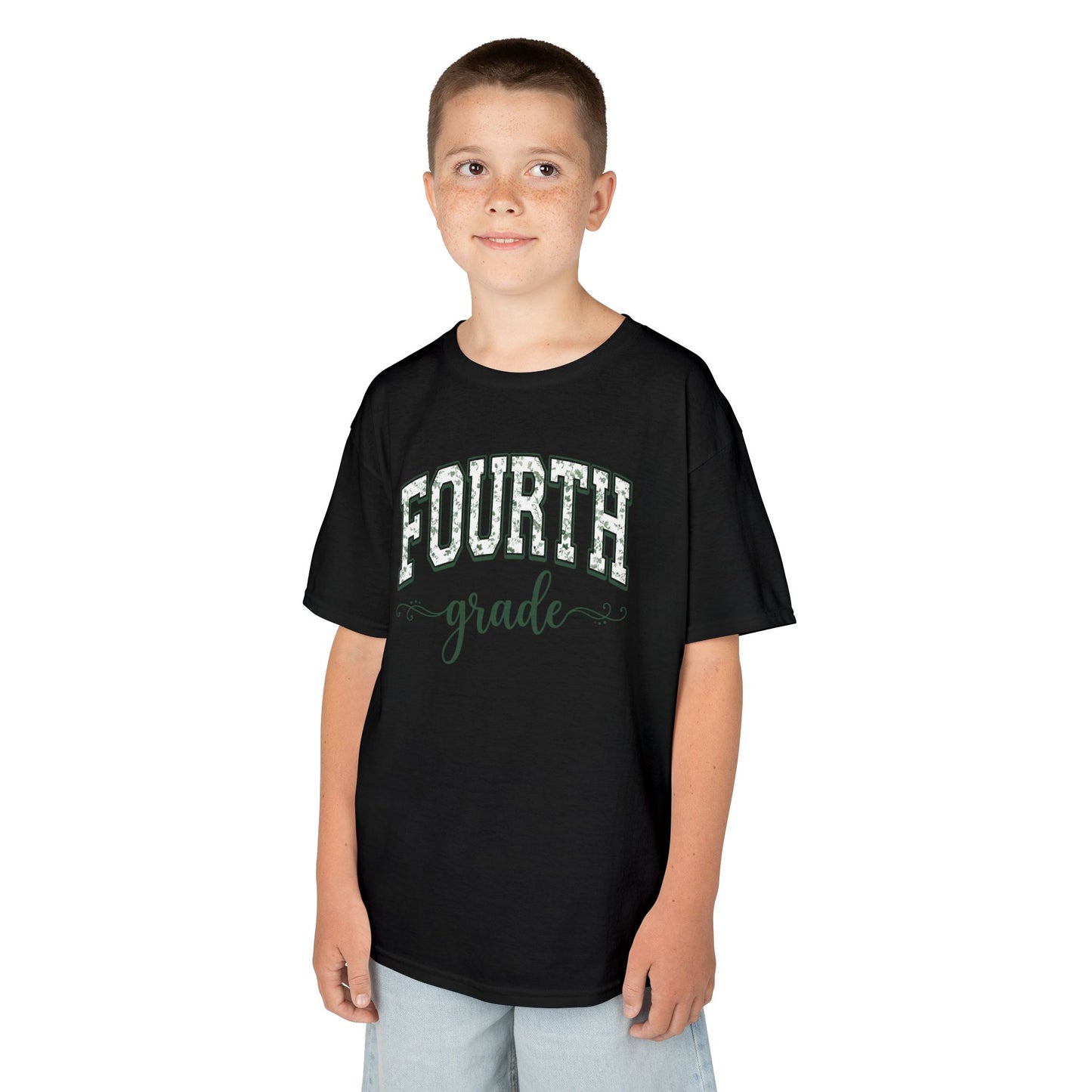 Child wearing a black t-shirt with 'FOURTH grade' text on a white background. Botanical fourth grade shirt for kids by TEEZOCA with hand-lettered script and a soft eucalyptus-green palette.
