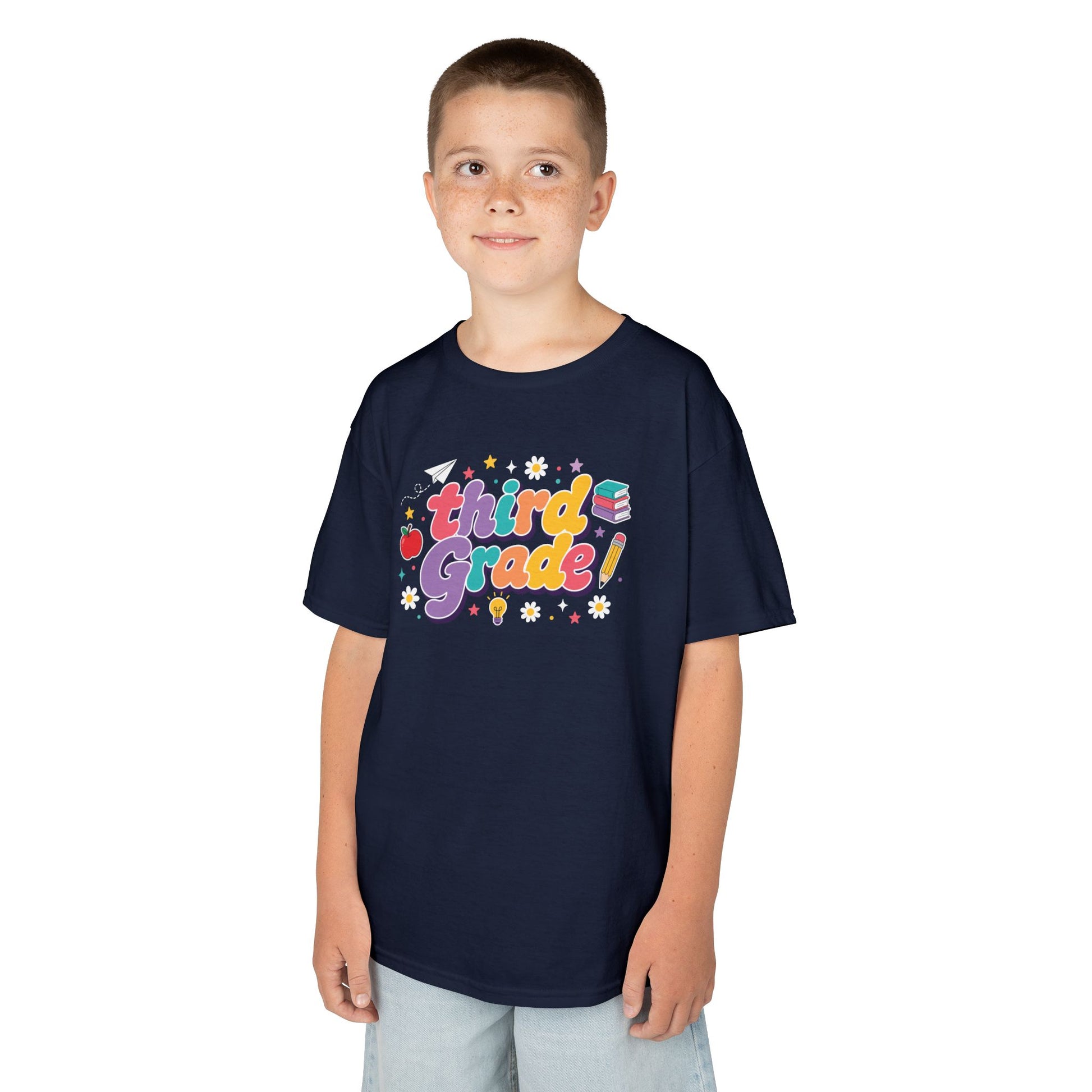 Child wearing a black t-shirt with 'Third Grade' text on a white background. TEEZOCA t-shirt with a cute classroom graphic for a 3rd Grade Shirt for Boys or a 3rd Grade Shirt for boys.