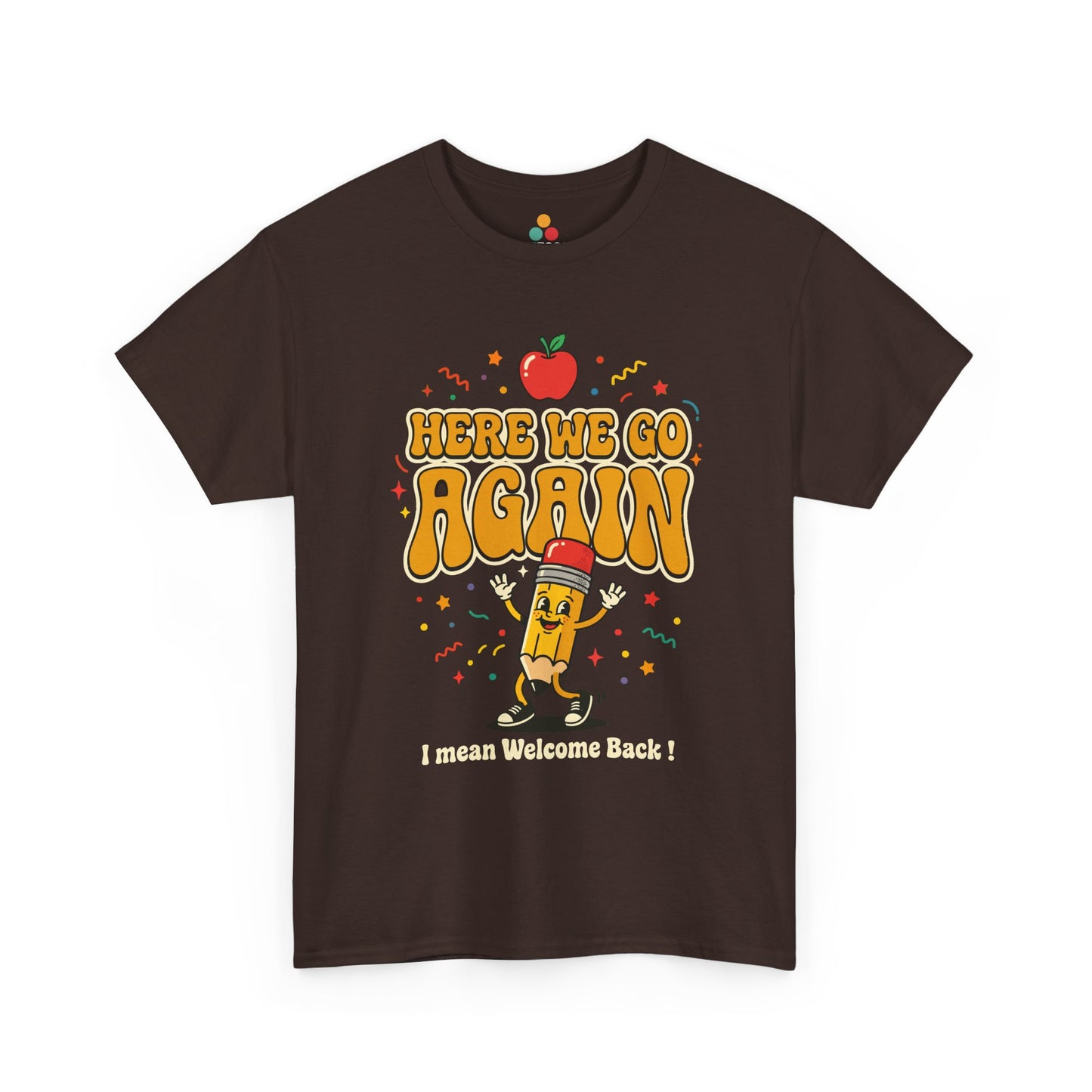 Close-up of a Brown T-shirt featuring a funny back to school design with the words “Here We Go Again” and “I mean Welcome Back!” plus a red apple and a pencil character.
