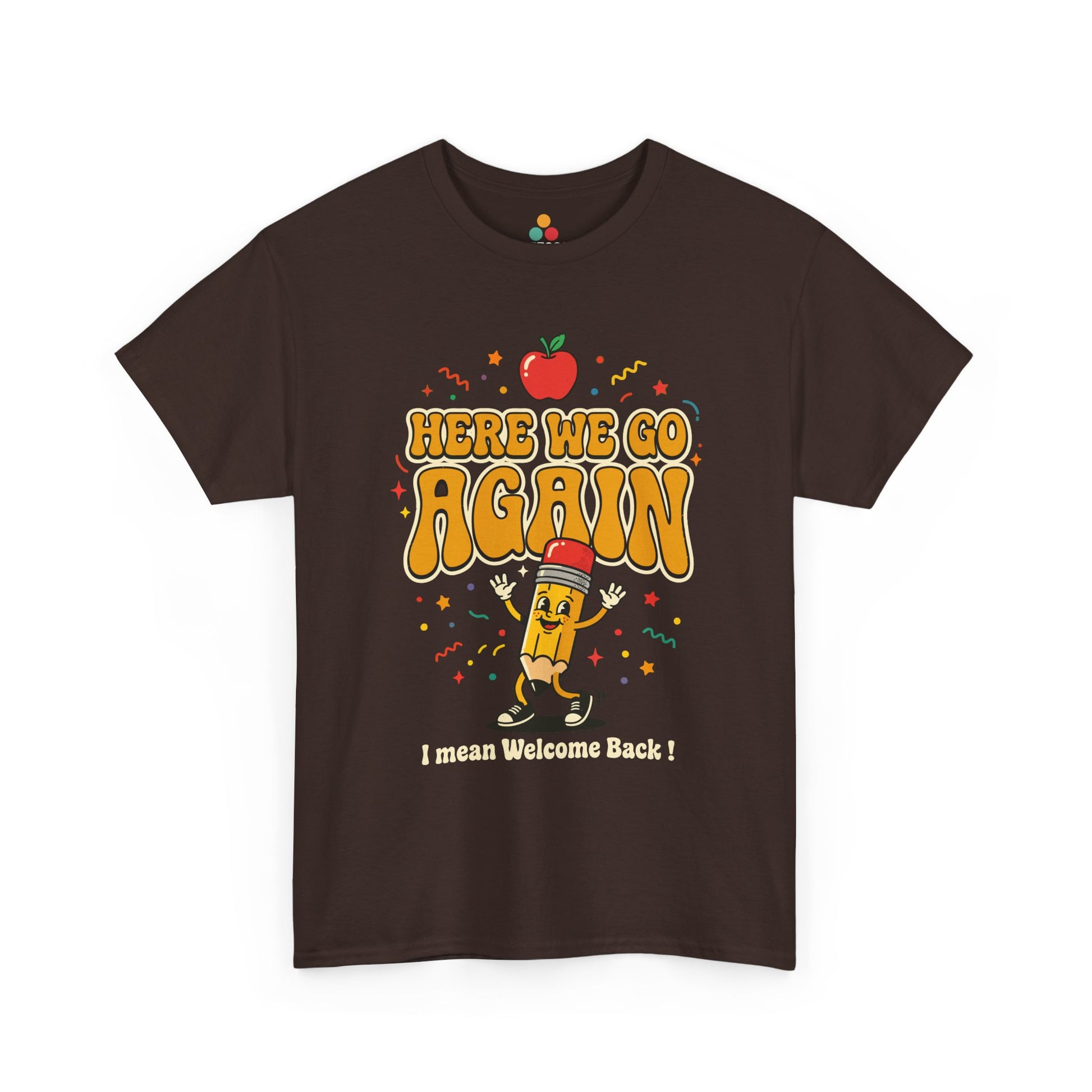 Close-up of a Brown T-shirt featuring a funny back to school design with the words “Here We Go Again” and “I mean Welcome Back!” plus a red apple and a pencil character.
