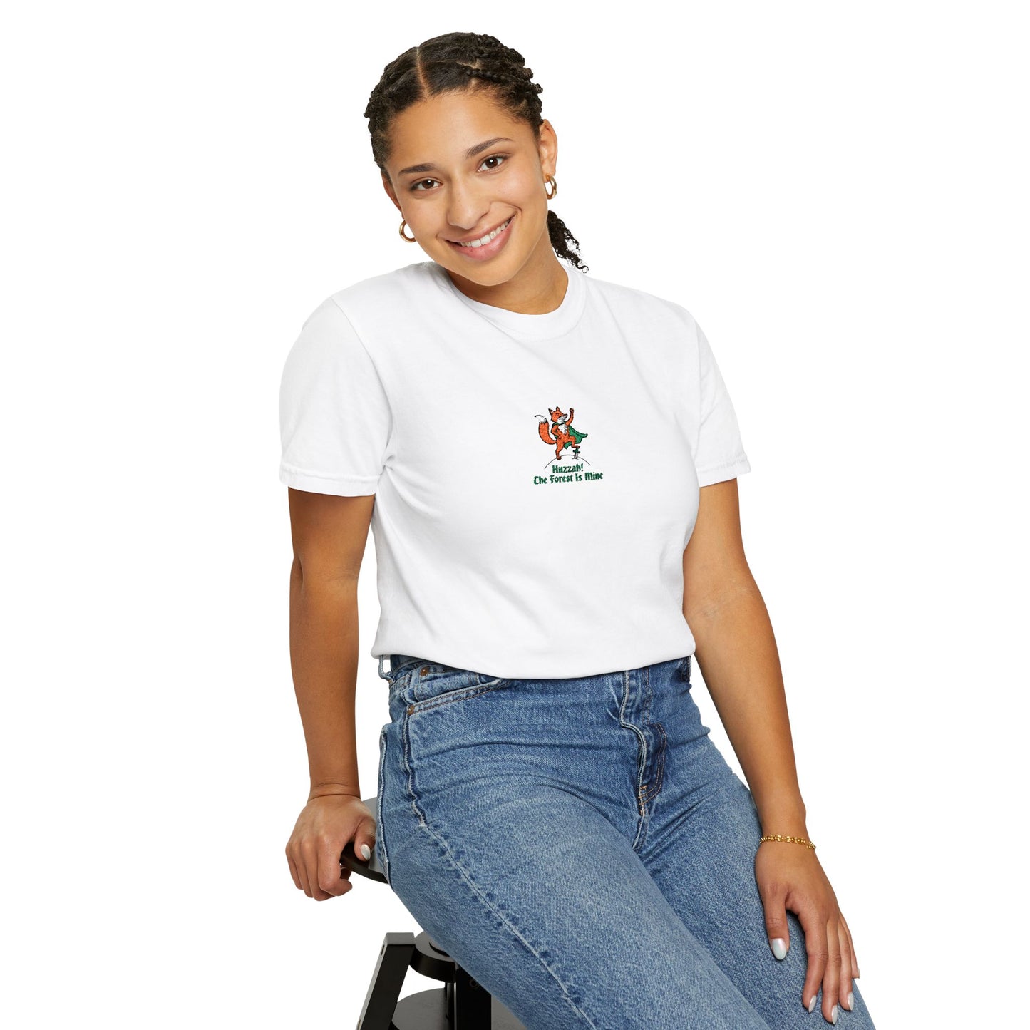 Close-up of a FEAMALE  Model  wearing white Comfort Colors®  
 shirt featuring an embroidered orange fox in a green cape with the saying "Huzzah! The Forest Is Mine."

