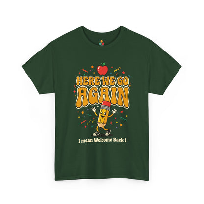 Close-up of a Forest Green T-shirt featuring a funny back to school design with the words “Here We Go Again” and “I mean Welcome Back!” plus a red apple and a pencil character.
