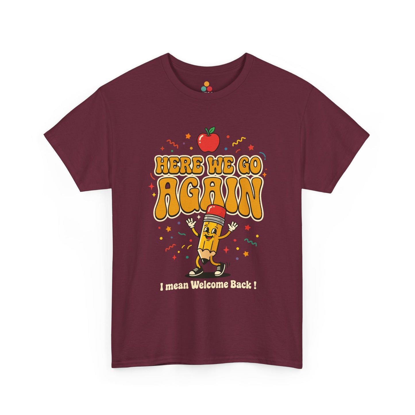 Close-up of a Maroon T-shirt featuring a funny back to school design with the words “Here We Go Again” and “I mean Welcome Back!” plus a red apple and a pencil character.
