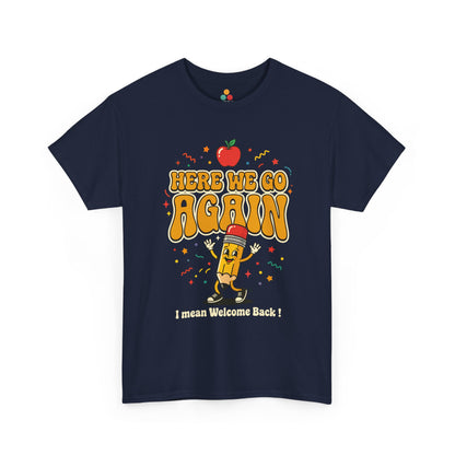 Close-up of a Navy BlueT-shirt featuring a funny back to school design with the words “Here We Go Again” and “I mean Welcome Back!” plus a red apple and a pencil character.

