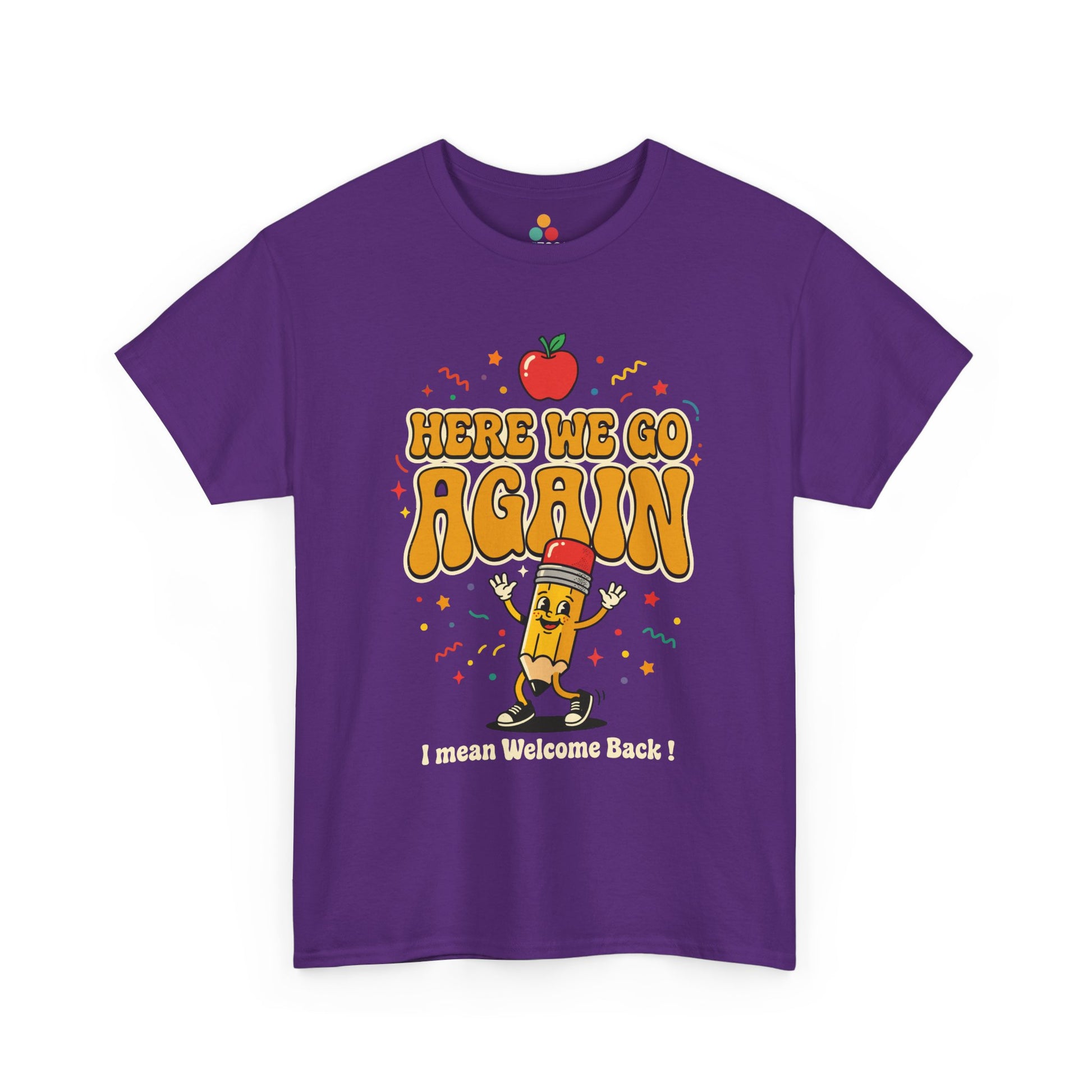 Close-up of a Purple T-shirt featuring a funny back to school design with the words “Here We Go Again” and “I mean Welcome Back!” plus a red apple and a pencil character.

