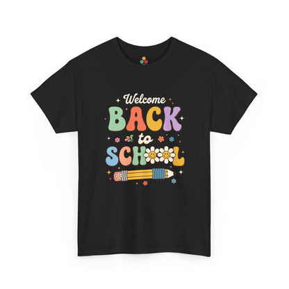 Close-up of a black T-shirt featuring a colorful retro "Welcome Back to School" graphic with groovy lettering, smiling pencils, flowers, and pastel rainbow colors.

