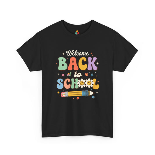 Close-up of a black T-shirt featuring a colorful retro "Welcome Back to School" graphic with groovy lettering, smiling pencils, flowers, and pastel rainbow colors.

