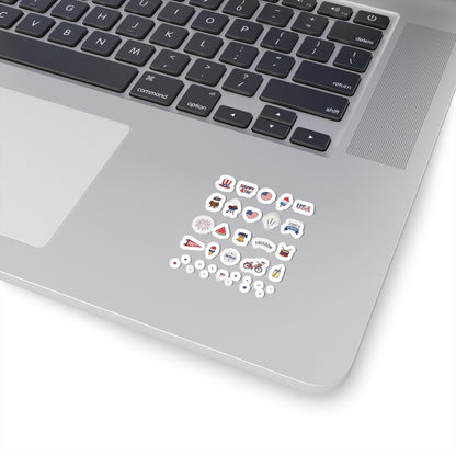 Close-up of a silver laptop corner decorated with an entire collection of mini TEEZOCA holiday doodle decals.
