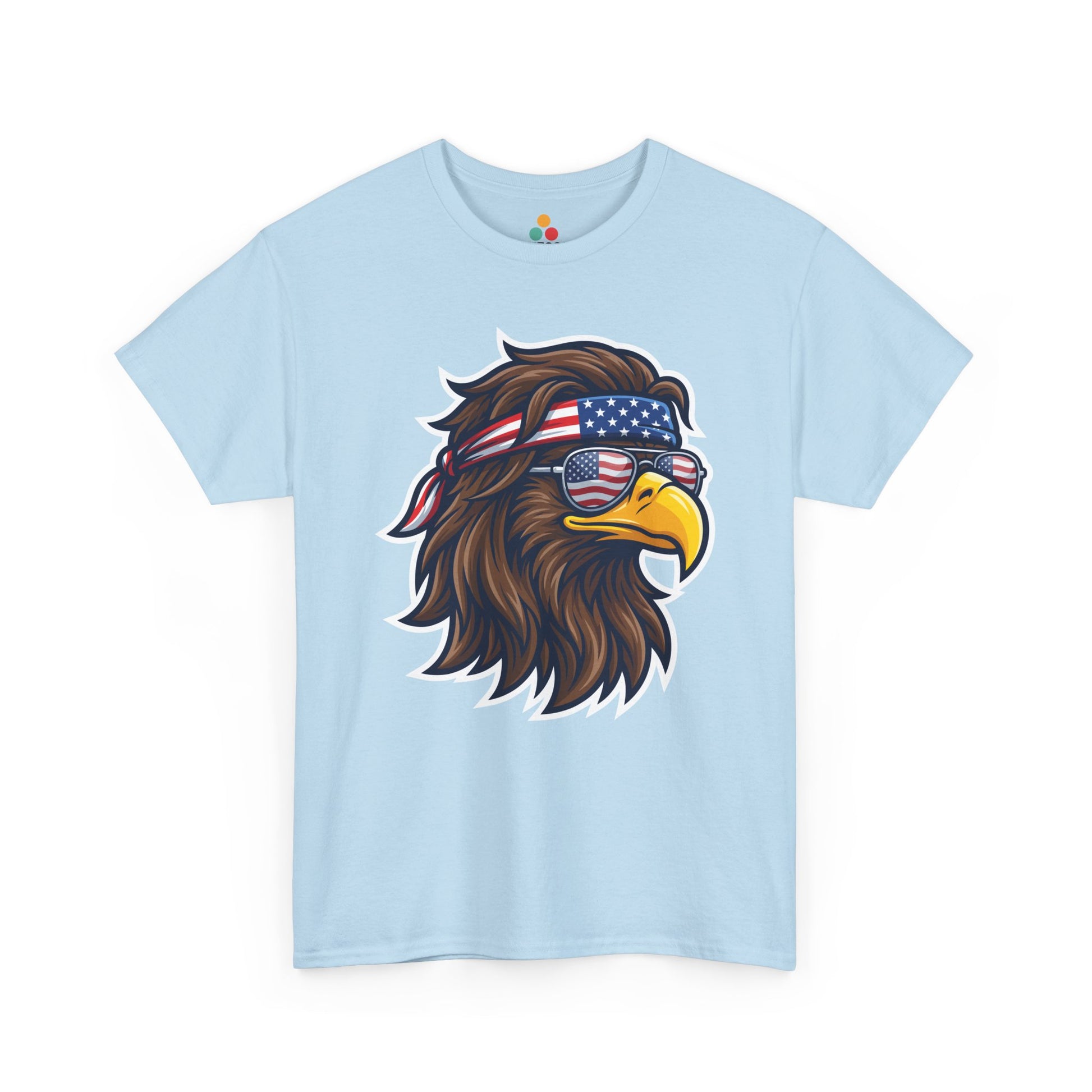 Close-up view of TEEZOCA T-Shirt featuring a fierce bald eagle wearing a USA flag bandana and star-spangled sunglasses printed on light blue fabric.


