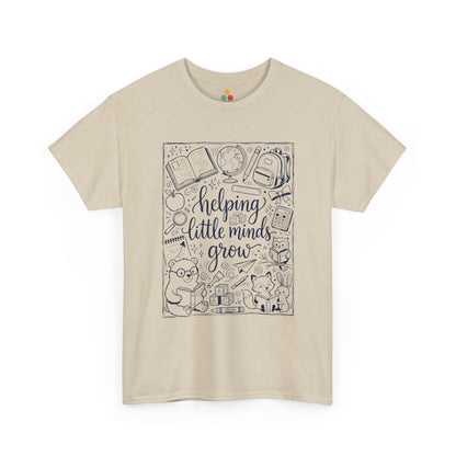 Close up view of TEEZOCA T-Shirt with black and white back to school teacher design featuring “helping little minds grow” and school doodles on Beige fabric.

