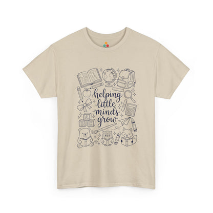 Close up view of TEEZOCA T-Shirt with black and white “helping little minds grow” back to school teacher design on Biege fabric.

