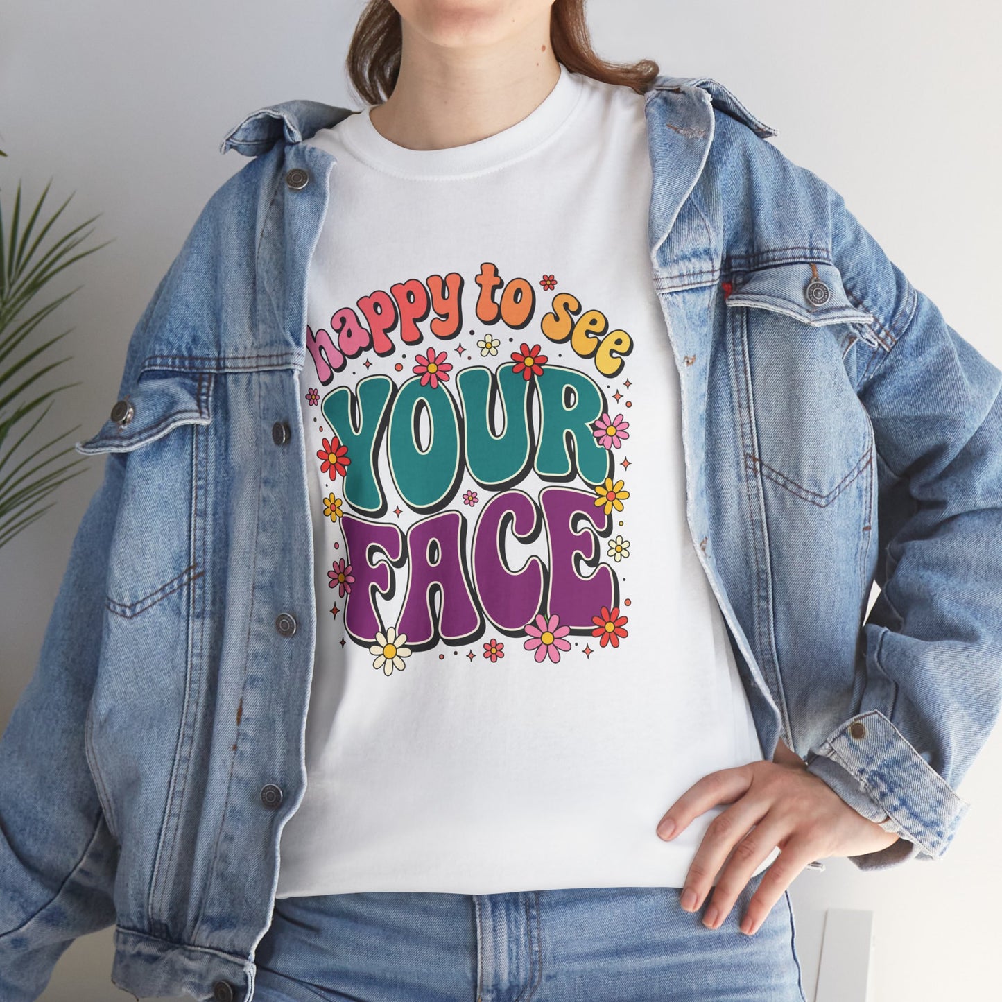  Close up view of TEEZOCA T-Shirt with colorful “Welcome Back to School” cartoon design featuring smiling flowers, stars, and a pencil on White tee shirt

