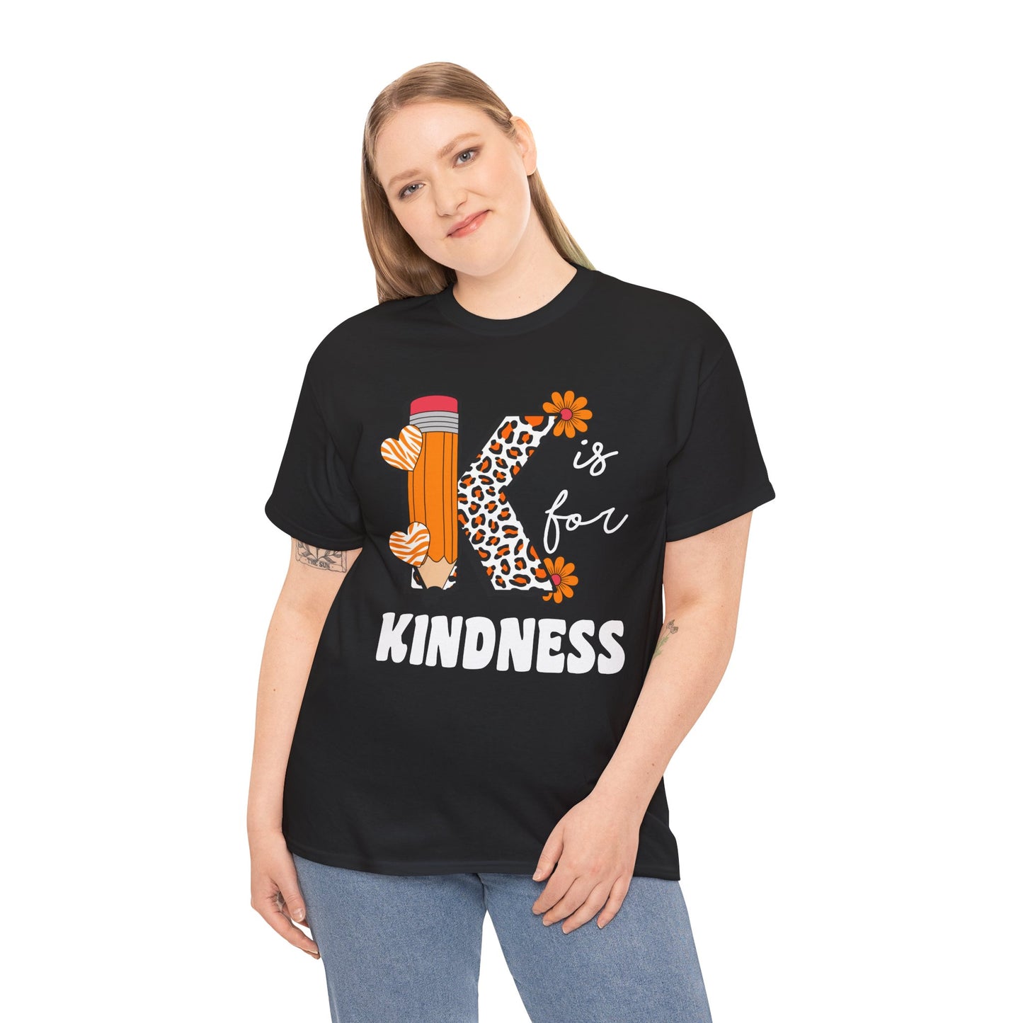 “Female model in Teezoca K is for Kindness shirt, teacher gift with leopard K, pencil, hearts, flowers, black unisex t-shirt, front”

