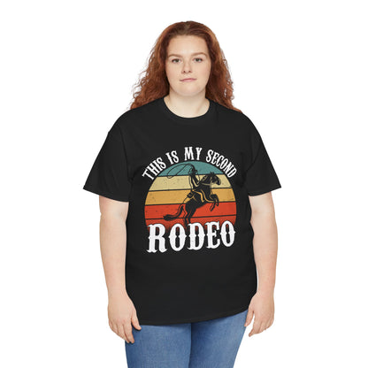 “Female model in Teezoca This Is My Second Rodeo shirt, distressed sunset cowboy graphic, funny western rodeo tee, front”

