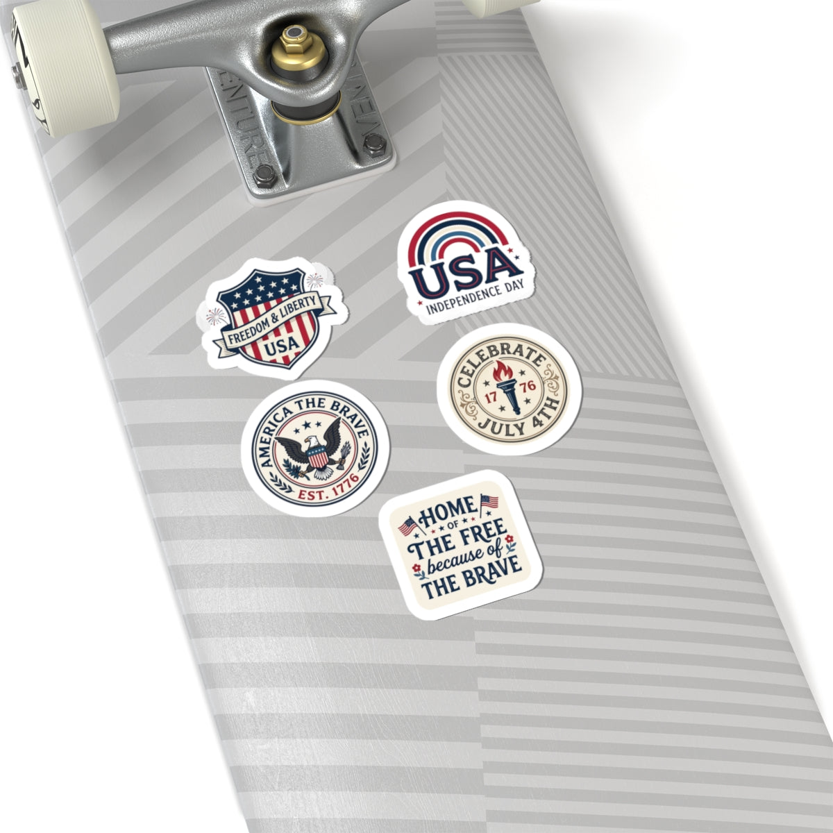 Five unique TEEZOCA retro USA stickers decorating the top surface of a light grey striped skateboard.