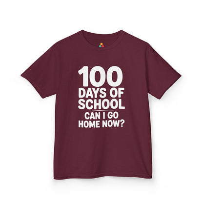 Flat lay of a maroon TEEZOCA “100 Days Of School Can I Go Home Now?” Kids graphic t‑shirt.