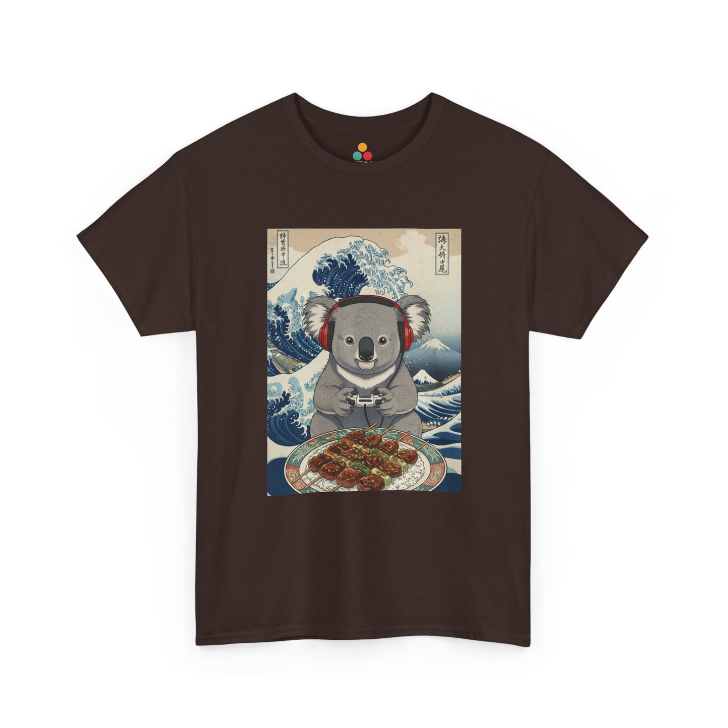 Front view of TEEZOCA graphic brown T-shirt featuring a koala wearing red headphones and holding a game controller, seated before a takoyaki tray, illustrated in Hokusai's Great Wave off Kanagawa ukiyo-e woodblock print style with Japanese kanji characters on a light blue background.

