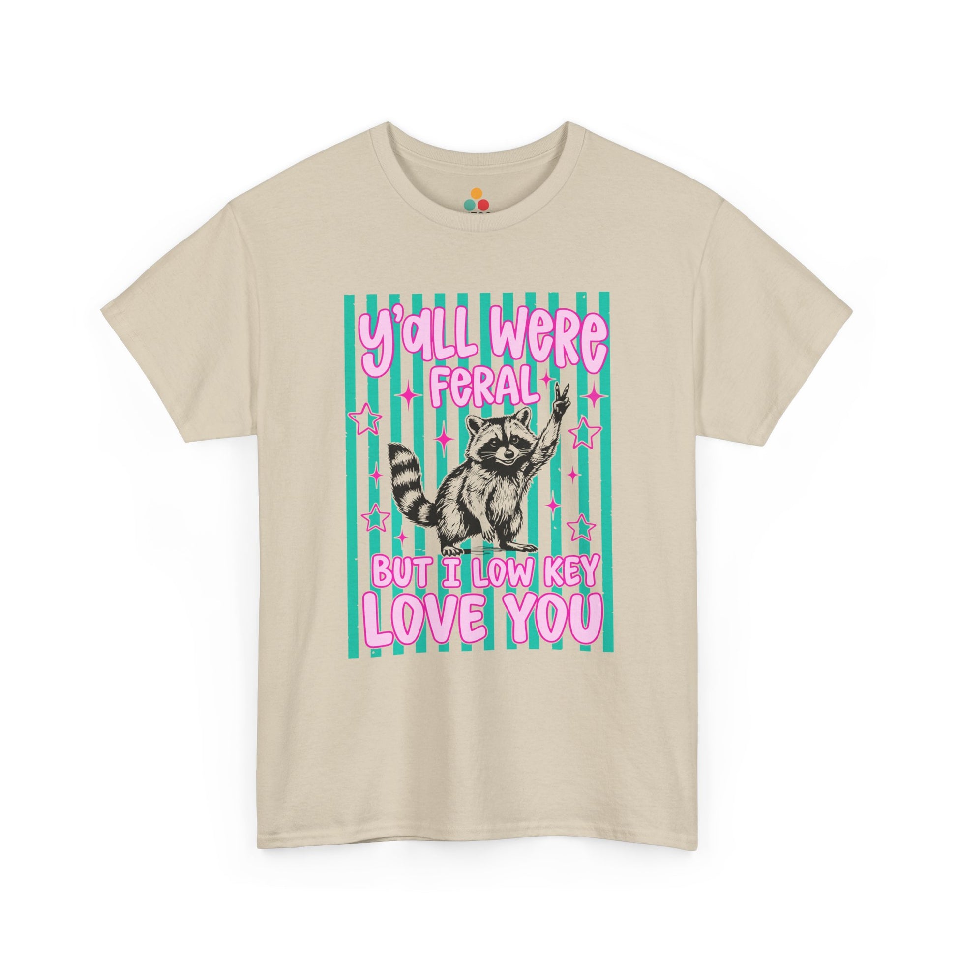 Funny teacher shirt by TEEZOCA with Y’all Were Feral But I Love You text, raccoon graphic, and bright classroom humor.
