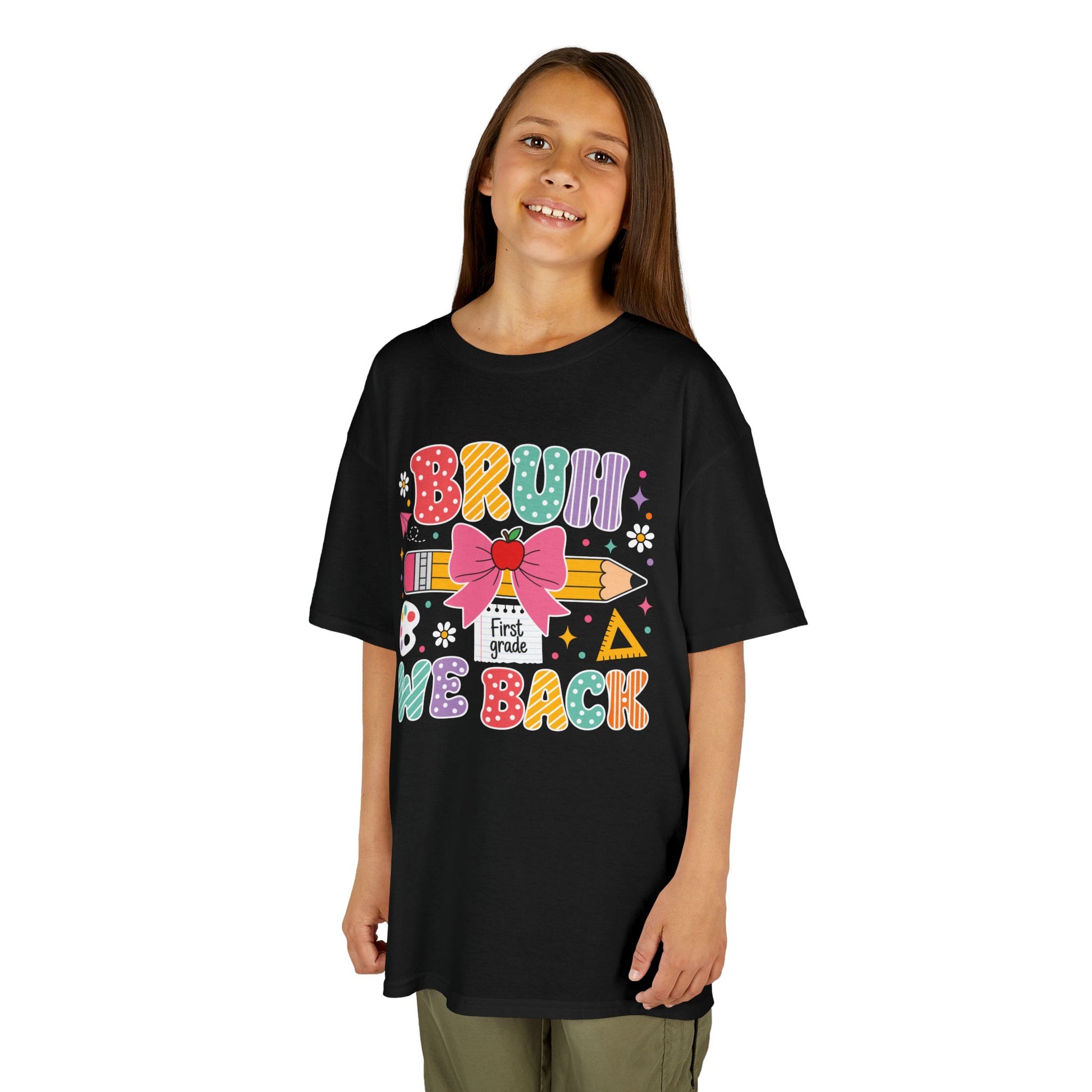 Girl wearing a black TEEZOCA Bruh We Back First Grade kids tee, a funny first-day-of-school shirt for the new school year.
