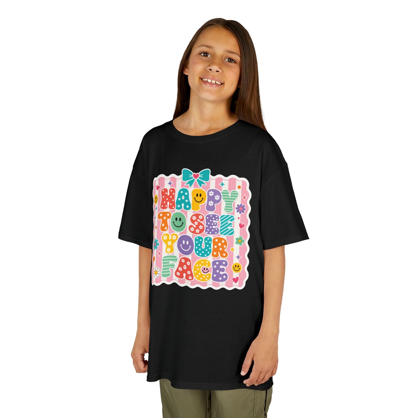 Girl wearing a black TEEZOCA Happy to See Your Face coquette kids tee with a bow, a cute back to school shirt for the new school year.
