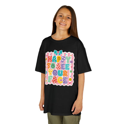 Girl wearing a black TEEZOCA Happy to See Your Face coquette kids tee with a bow, a cute back to school shirt for the new school year.
