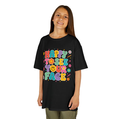 Girl wearing a black TEEZOCA Happy to See Your Face groovy kids tee, a cute retro back to school shirt for the new school year.
