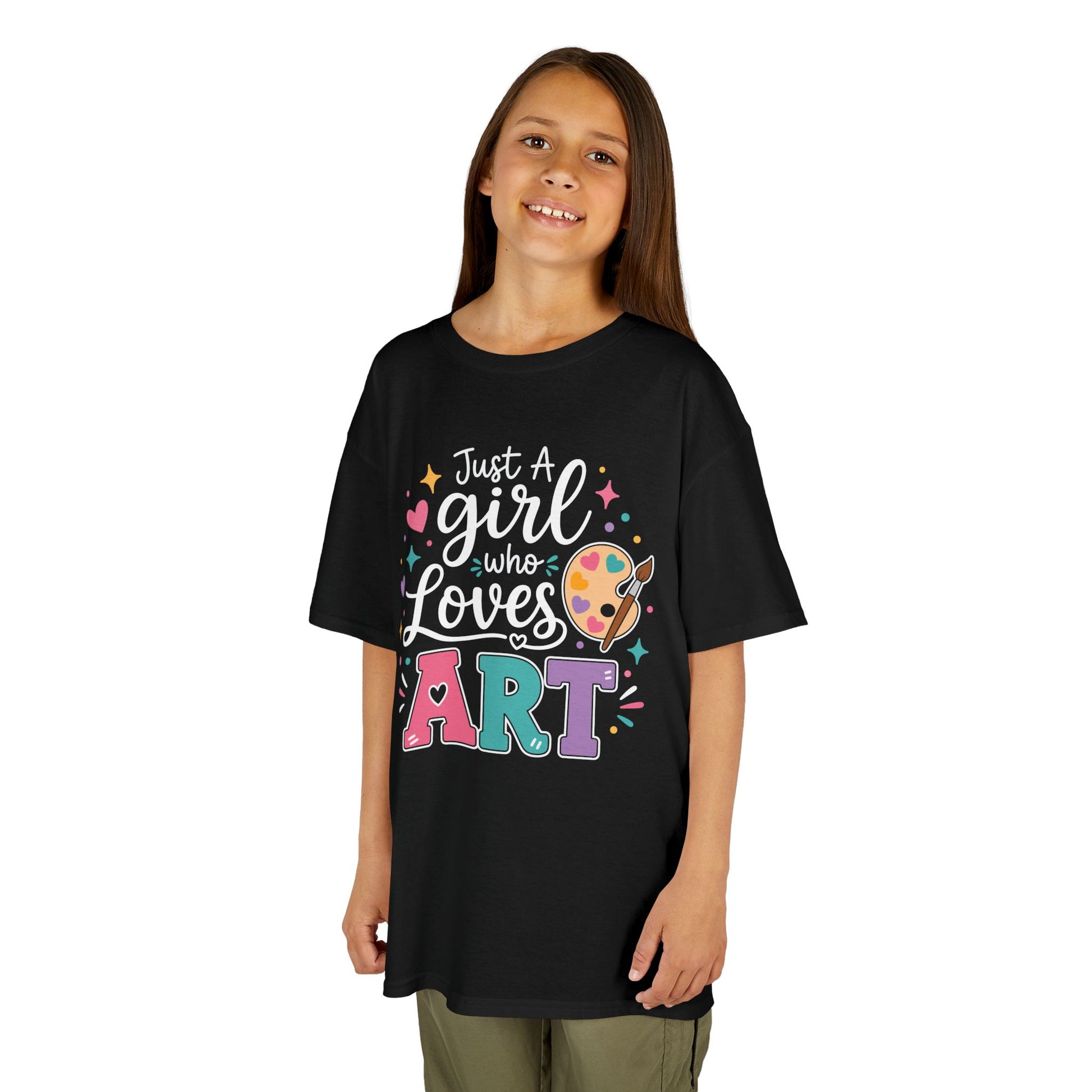 Girl wearing a black TEEZOCA Just a Girl Who Loves Art kids tee, a cute back to school shirt for a young artist.
