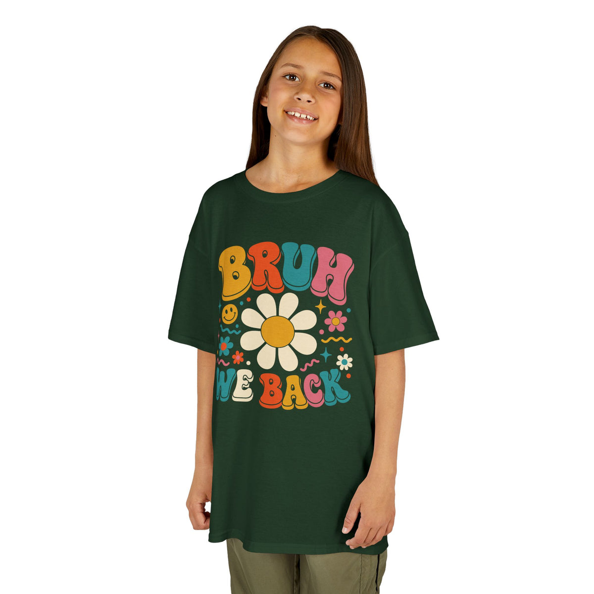 Girl wearing a forest green TEEZOCA Bruh We Back groovy kids tee, a funny back to school shirt for the new school year.
