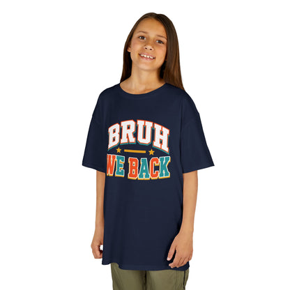 Girl wearing a navy TEEZOCA Bruh We Back varsity kids tee, a funny back to school shirt for the new school year.
