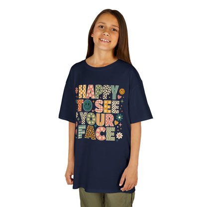Girl wearing a navy TEEZOCA Happy to See Your Face boho kids tee, a cute retro back to school shirt for the new school year.
