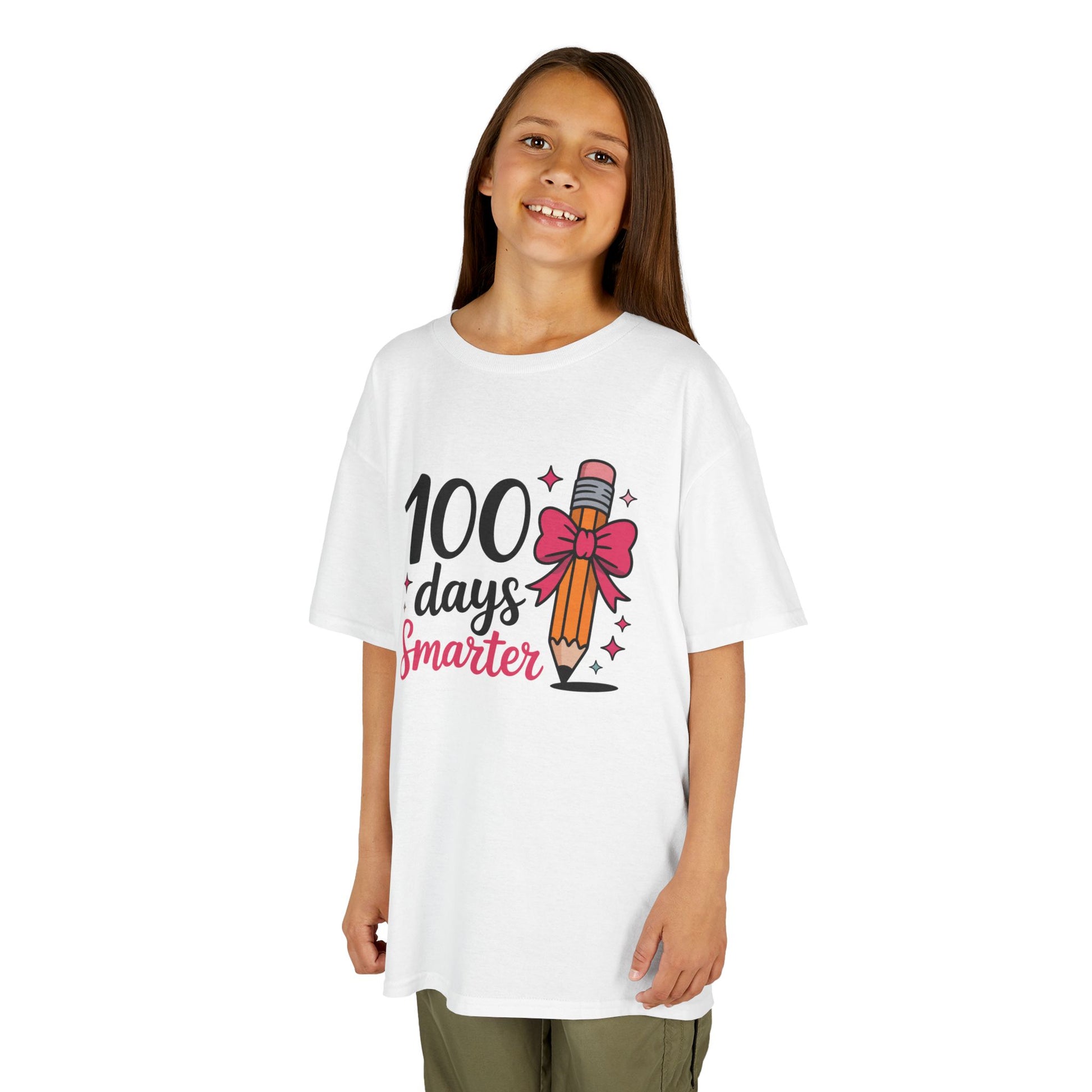 Girl wearing a white TEEZOCA “100 Days Smarter” pink bow pencil milestone t‑shirt.