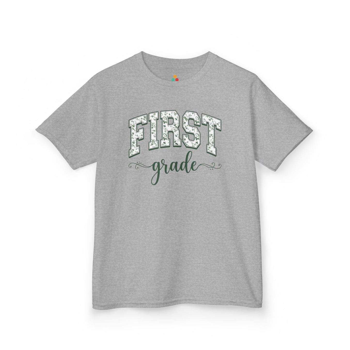 Gray t-shirt with white text on a white background. Cute first grade kids t-shirt from TEEZOCA for the first day of first grade, styled for a new first grader.
