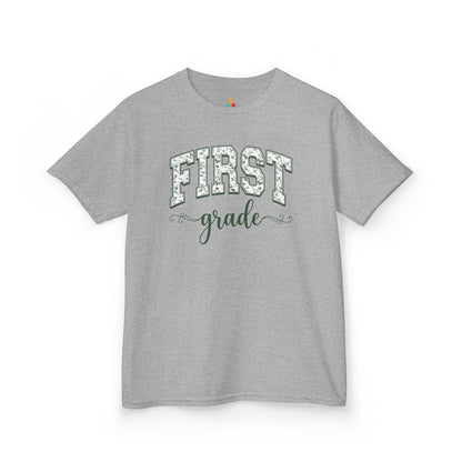 Gray t-shirt with white text on a white background. Cute first grade kids t-shirt from TEEZOCA for the first day of first grade, styled for a new first grader.
