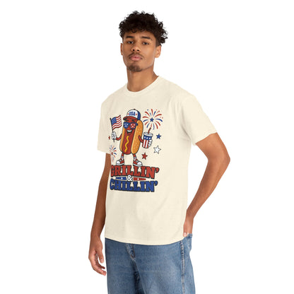Hot Dog Shirt Grillin & Chillin 4th of July BBQ T-shirt Gift | TEEZOCA hot dog shirt T-shirt with Grillin & Chillin text, USA cap, American flag, patriotic drink cup, fireworks, and stars.
