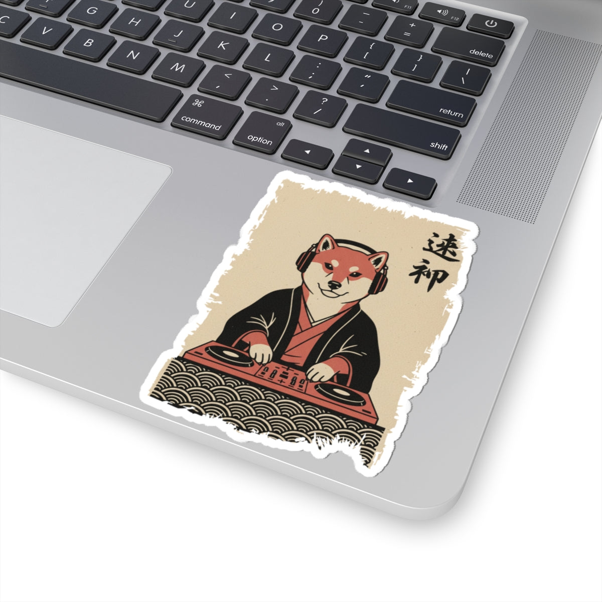 Laptop with a Vintage Japanese ukiyo-e style pug samurai shogun vinyl die-cut  sticker of a fox in traditional Japanese attire on the palm rest area.