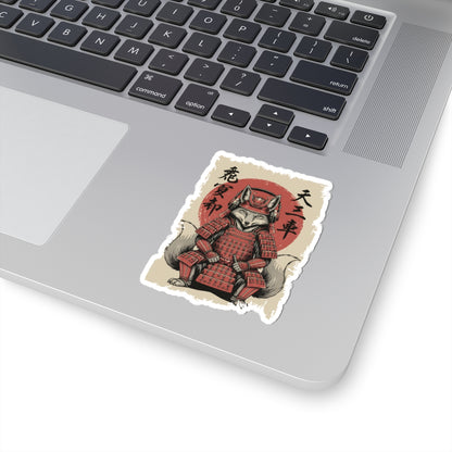 Laptop with a sticker of a fox in samurai armor on a white surface