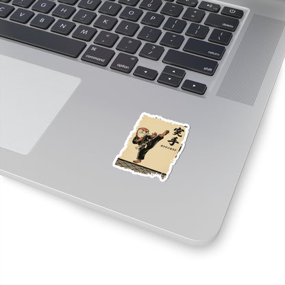 Laptop with a sticker of a martial artist on a beige background
