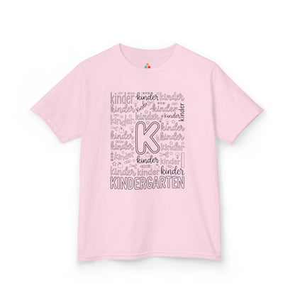 Light pink TEEZOCA kindergarten typography kids tee, a cute first day of kindergarten shirt for a little girl.
