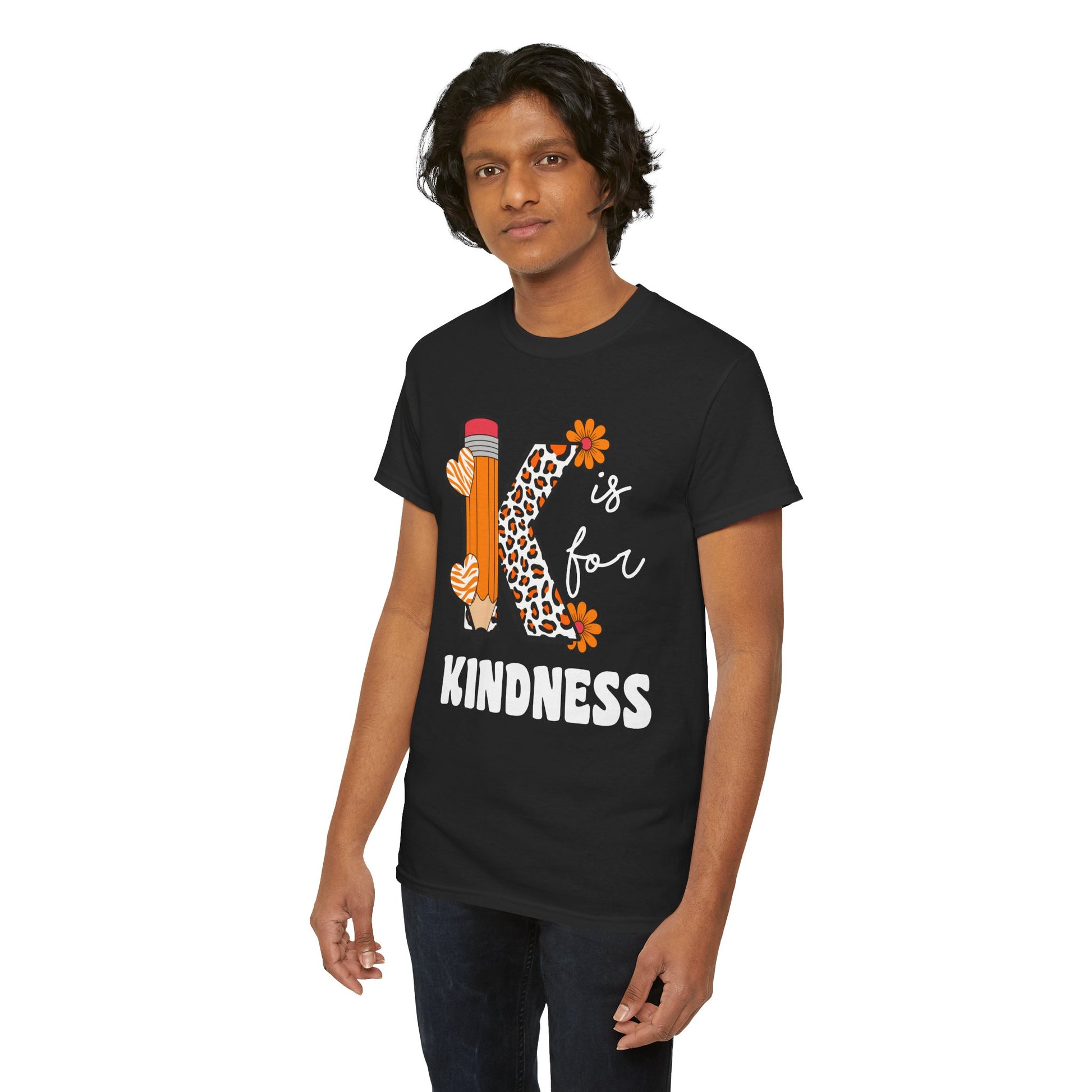 “Male model in Teezoca K is for Kindness shirt, teacher appreciation kindness design, leopard print K, pencil, heart and flower accents, front”

