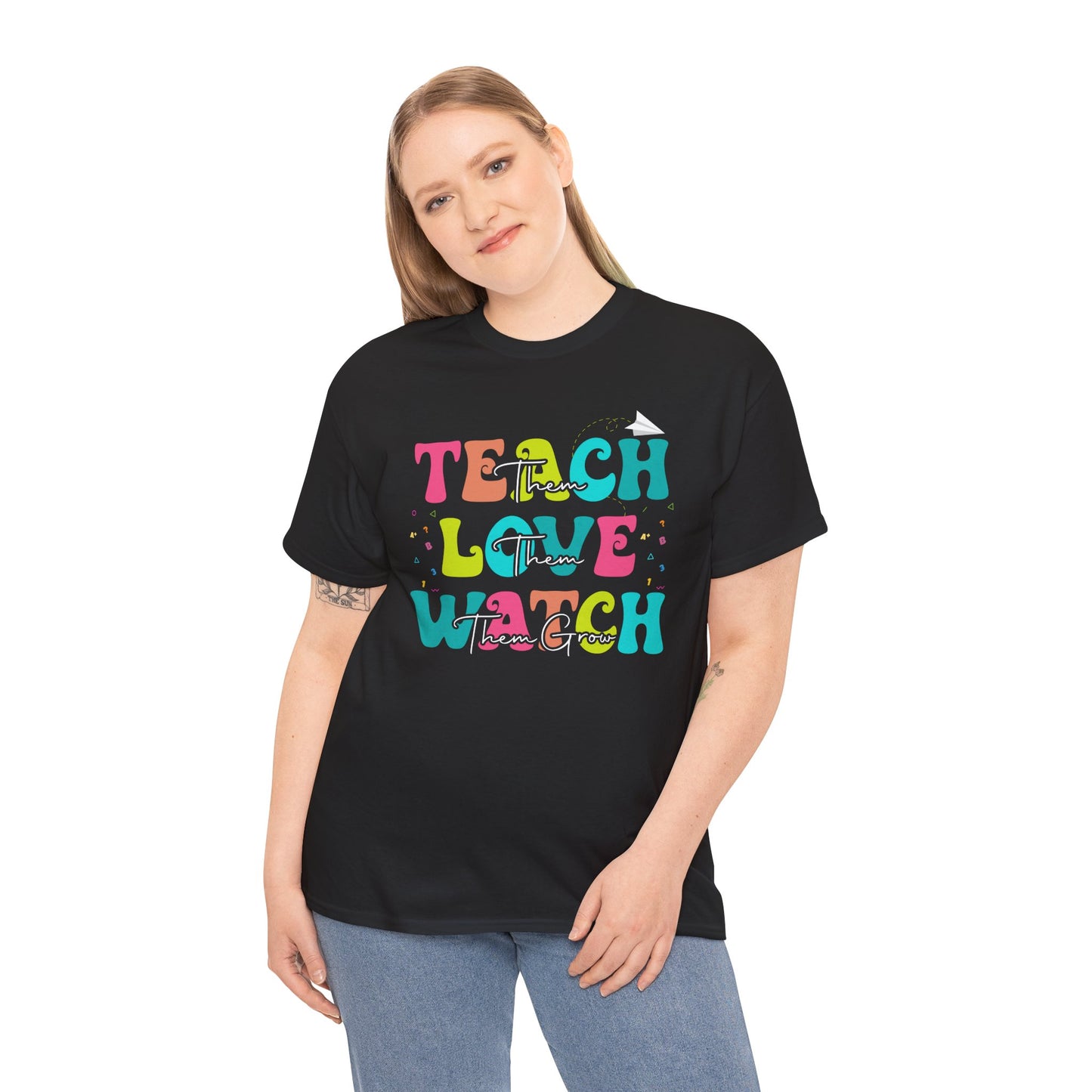 “Male model in Teezoca Teach Love Watch Them Grow shirt, teacher appreciation week design, colorful front print”

