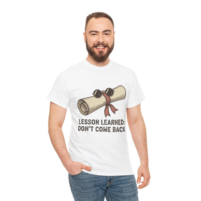 Male model smiling wearing TEEZOCA Lesson Learned T-Shirt with sarcastic graduation design in white.