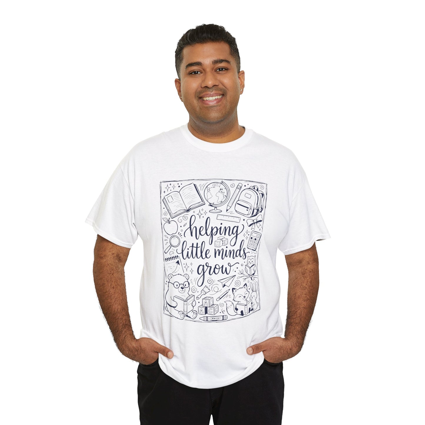Man Wearing TEEZOCA White T-Shirt with black and white back to school teacher design featuring “helping little minds grow” and school doodles 
