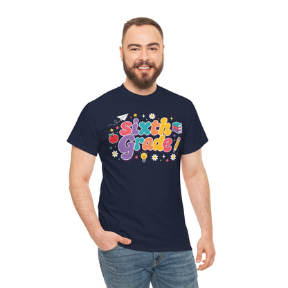 Man wearing a navy t-shirt with 'Sixth Grade!' design on a white background. A bright TEEZOCA t-shirt with retro “Sixth Grade” letters and playful school symbols for shoppers browsing sixth grade teacher shirts on Amazon.
