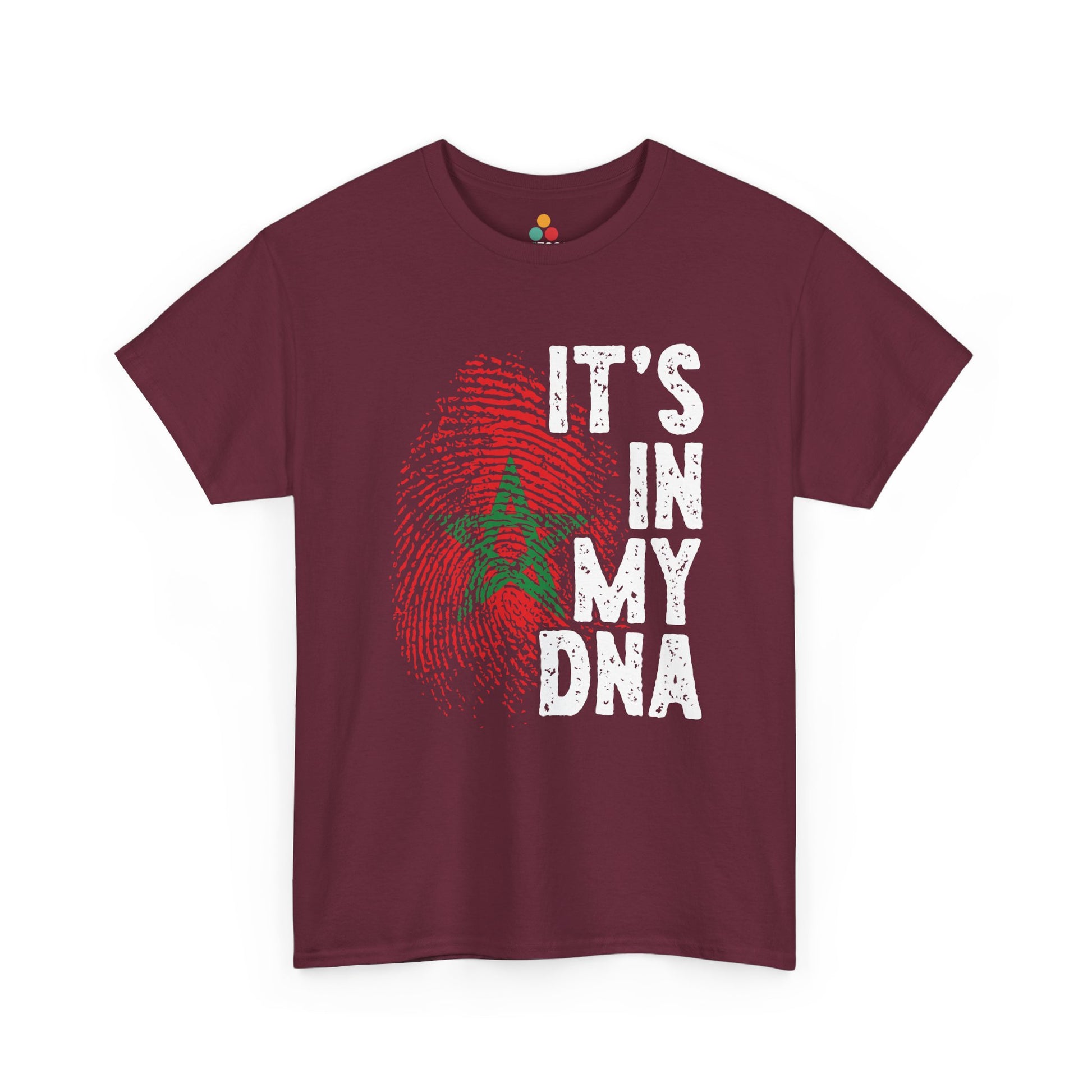 Maroon T-shirt featuring a red and green fingerprint in the design of the Moroccan flag with the star symbol, paired with the phrase "It's In My DNA," a Moroccan pride heritage shirt and cultural identity tee.


