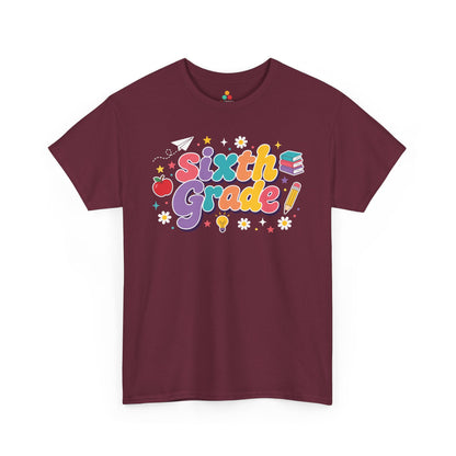 Maroon t-shirt with 'Sixth Grade!' text and graphics on a white background. TEEZOCA t-shirt pairs bold “Sixth Grade” text with an apple, books, a pencil, and a light bulb for matching sixth grade teacher squad shirts.