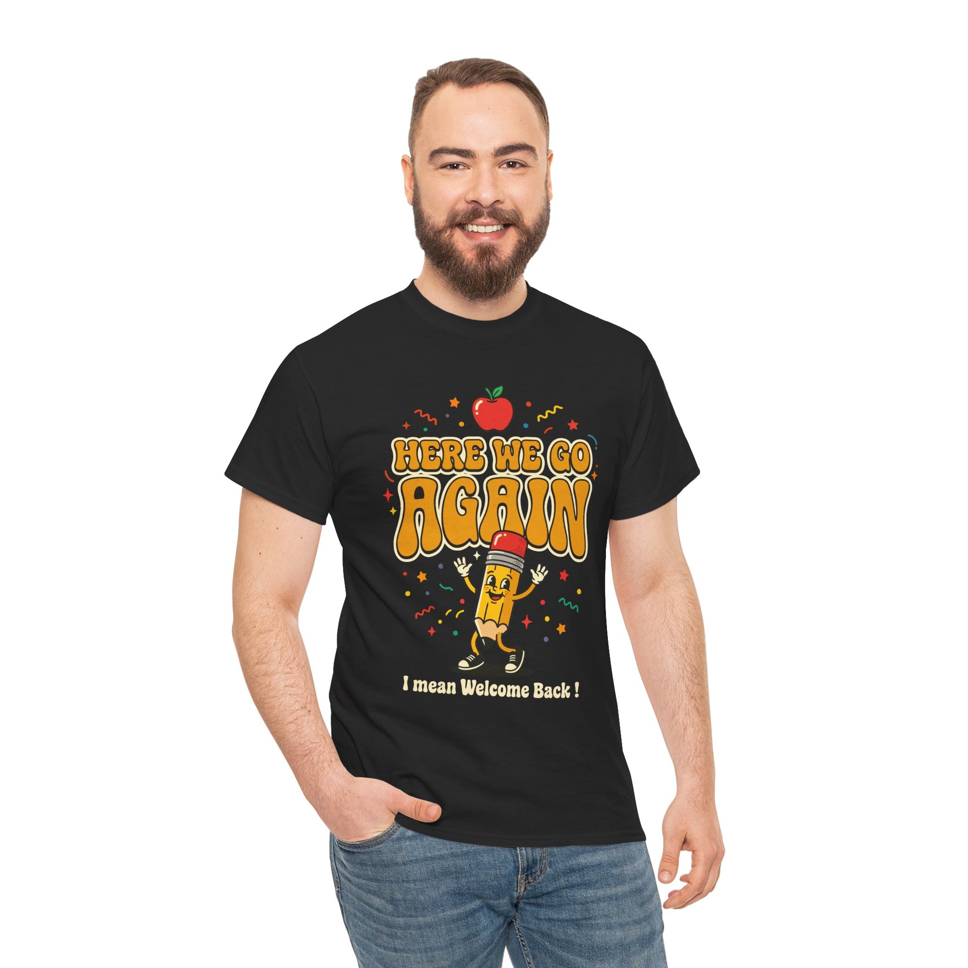 Men wearing Black T-shirt featuring a funny back to school design with the words “Here We Go Again” and “I mean Welcome Back!” plus a red apple and a pencil character.
