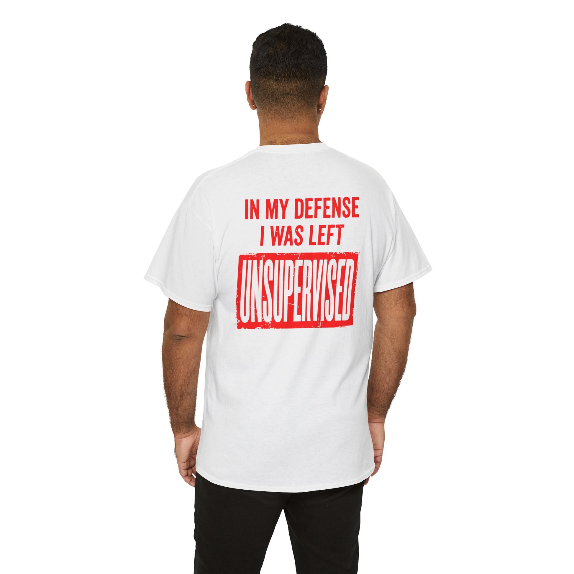Men wearing a Back Print of a light pink T-shirt featuring the bold red and cream quote “In My Defense I Was Left Unsupervised,” a funny back print statement tee with retro typography, sarcastic quote shirt, witty adult humor graphic, dry humor novelty apparel, bold statement t-shirt, and playful sarcasm design for fans of funny quote shirts.
