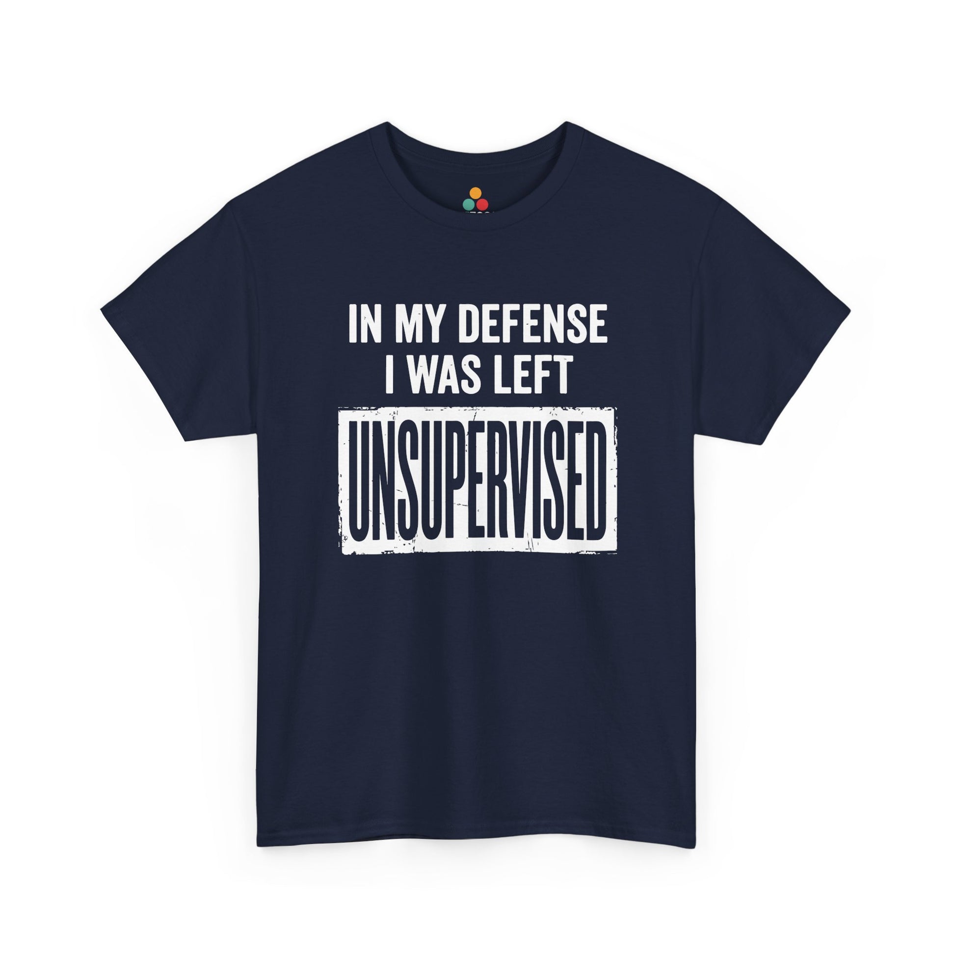 Navy T-shirt featuring bold white block typography reading "In My Defense I Was Left Unsupervised" with a highlighted "UNSUPERVISED" text box, funny sarcastic quote shirt, witty statement tee, dry humor graphic tee, and bold novelty quote apparel.